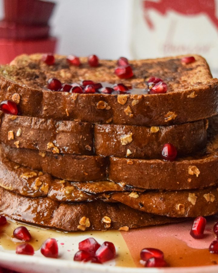 5 pieces of french toast topped with pomegranate